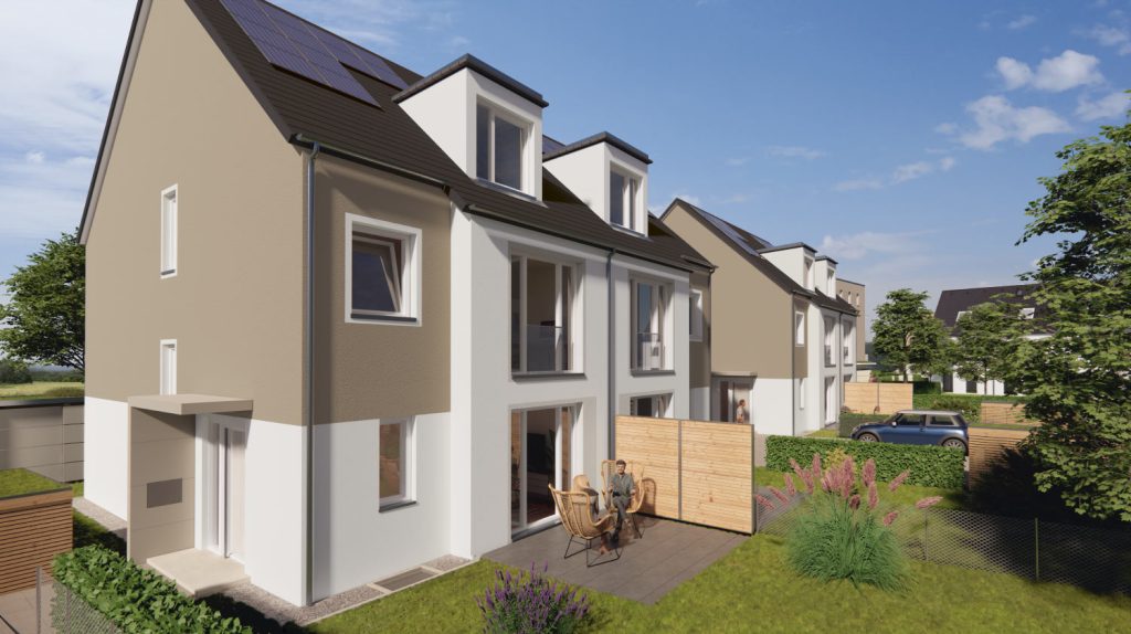 Moderne Doppelhaushälfte mit dunklem Satteldach und einem Garten mit Terasse.
